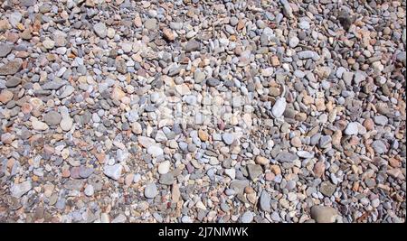 Sea stones background, small rocks. Stock Photo
