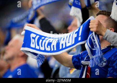 Feature, fan with fan scarf Glueck on soccer 2nd Bundesliga, 33rd matchday, FC Schalke 04 (GE) - FC St. Pauli Hamburg Hamburg 3: 2, on May 7th, 2022 in Gelsenkirchen/Germany. #DFL regulations prohibit any use of photographs as image sequences and/or quasi-video # Â Stock Photo