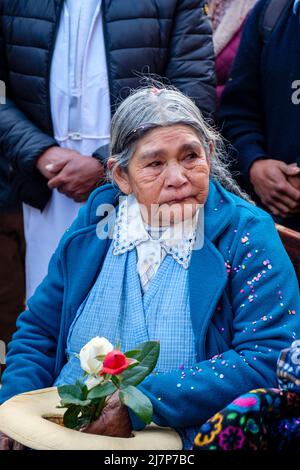 Latin American elderly people senior Peruvian woman, devotee at a religious festival in Ollantaytambo, Urubamba Valley, Peru Stock Photo
