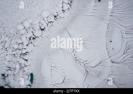 Patterns in the melting snow on Twin Lakes, high in the Washingt Stock Photo