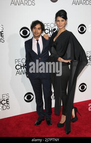 LOS ANGELES - JAN 8:  Kunal Nayyar, Neha Kapur at the People's Choice Awards 2014 Arrivals at Nokia Theater at LA LIve on January 8, 2014 in Los Angeles, CA Stock Photo