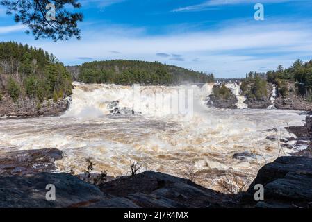 The St Maurice river at the Shawinigan devil’s hole during the spring floods, Quebec, Canada Stock Photo