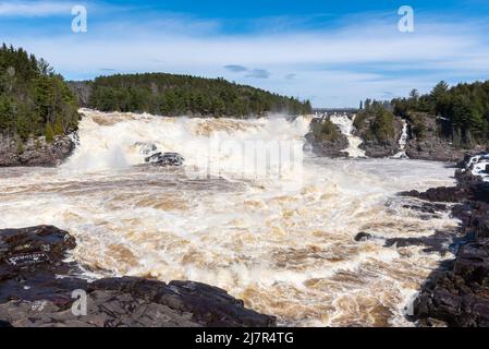 The St Maurice river at the Shawinigan devil’s hole during the spring floods, Quebec, Canada Stock Photo