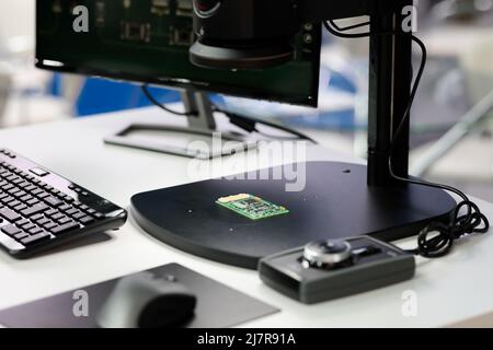 PCB inspection and quality control workstation with digital microscope. Selective focus. Stock Photo
