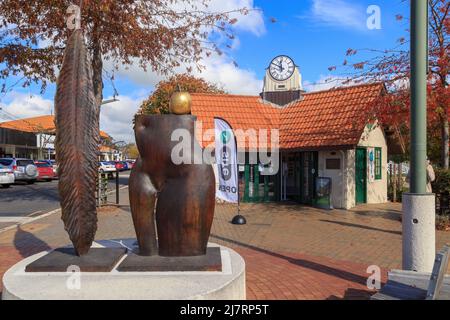 The i SITE visitor information center in Havelock North, New Zealand, located in the 1914 clock tower. The sculpture in front is called 'The Garden' Stock Photo