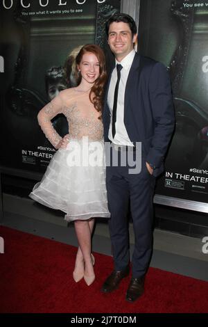 LOS ANGELES - APR 3:  Annalise Basso, James Lafferty at the 'Oculus' Los Angeles Screening at the TCL Chinese 6 Theaters on April 3, 2014 in Los Angeles, CA Stock Photo