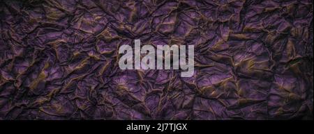 Dark purple with gold paint crumpled paper texture background Stock Photo