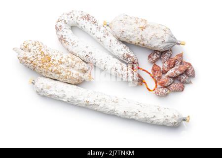 Traditional sausage with white mold. Dried pork salami isolated on white background. Stock Photo