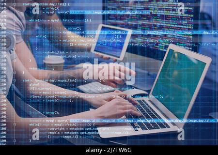 Double exposure of programmers in office and computer code Stock Photo