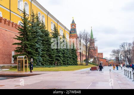 Moscow, Russia - April 10, 2022: People walking in Alexander Garden nearby Kremlin wall in Moscow, Russia Stock Photo