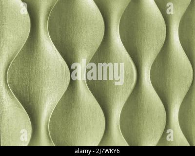 Light green 3D interior decorative wall panel with unusual wavy geometric shape. Wooden olive background with wave pattern. Abstract texture ornate. Stock Photo