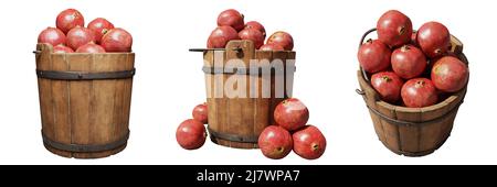 pomegranates, wooden buckets filled with juicy fruits, set isolated on white background Stock Photo
