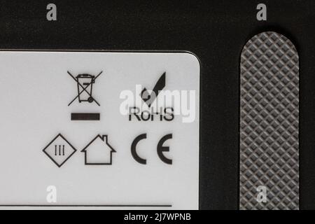 ROHS Restriction of Hazardous Substances, CE symbol logo and recycling information on robotic vacuum cleaner - disposal recycling recycle logo symbol Stock Photo