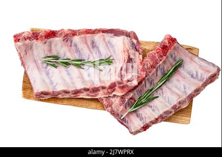 Raw Pork ribs with rosemary isolated on white. Raw pork ribs. Raw meat, Whole raw pork ribs. lamb meat spare ribs or belly. Fresh meat and ingredients Stock Photo