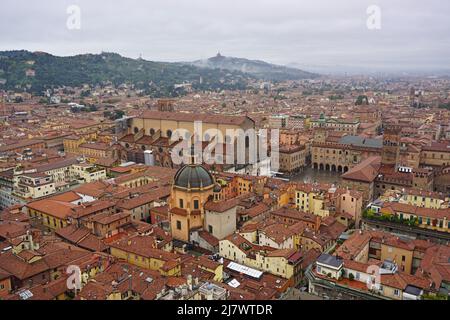 Panoramic view over Bologna right after the rain, from the top of the Asinelli Tower, with misty hills in the background Stock Photo