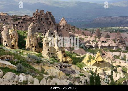 A beautiful view of Pigeon Valley at Uchisar in Turkey showing former cave homes built into volcanic rock formations known as fairy chimneys. Stock Photo