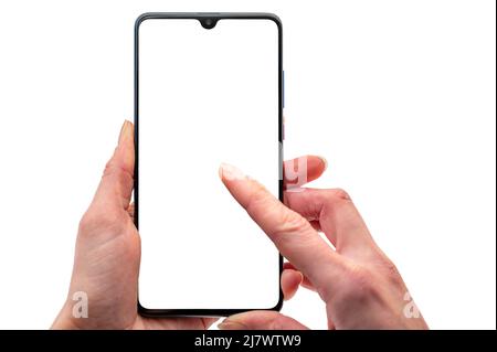 Woman typing on a smartphone with blank screen for customisation Stock Photo