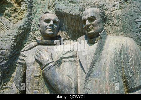 Lab technician and cosmonaut on the East facing side. At the Cosmonaut Monument complex in Tashkent, Uzbekistan. Stock Photo