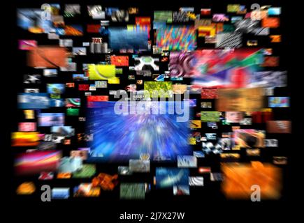 Multiple screens to infinity. Broadcast, Information worm hole, Streaming Multiple screens showing a mosaic of hundreds of images. Streaming Televisio Stock Photo