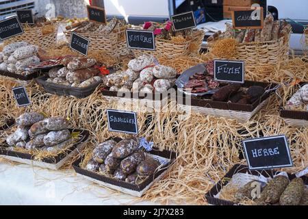 Various types of local sausages (saucisson) in Lyon's main street market, Saint-Antoine Célestins Stock Photo