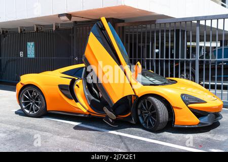 Miami Beach, Florida USA - April 14, 2021: yellow McLaren P1 2012, side view. luxury hypercar Stock Photo