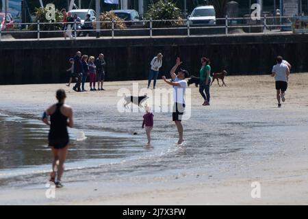 Weymouth, Dorset, UK. 6th May 2022. Day-trippers and holiday makers enjoy the beach at Weymouth in Dorset on one of the hottest days of the year. Stock Photo
