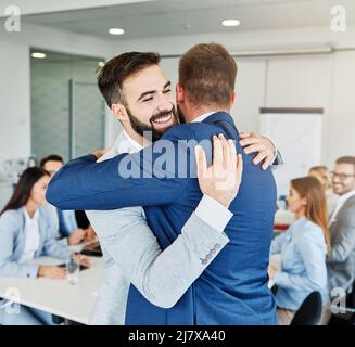 hug hugging coworker love partner office business happy relationship Stock Photo