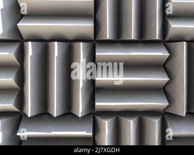 Grey dampening acoustic foam in the vocal recording room. Stock Photo