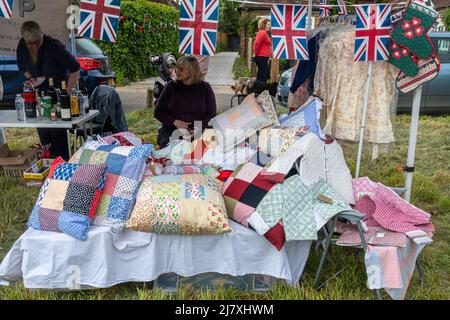 Dunsfold village fete, Surrey, England, UK. Stalls with handicrafts and bottles Stock Photo