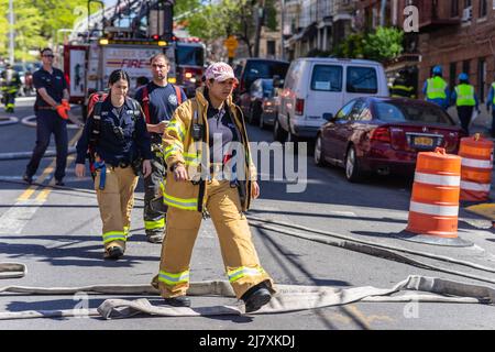 One person died and eight others were hurt, including three firefighters after a fire broke out in a home in the Fordham section of the Bronx, NY May 10, 2022. The four alarm fire tore through a two story home on 2194 Valentine Avenue, FDNY Acting Chief of Fire Operations Richard Blatus said that one person was found inside the home and pronounced deceased on the scene. (Photo by Steve Sanchez/SipaUSA). Stock Photo