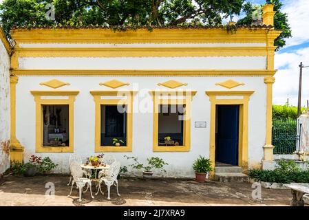 Yellow front facade of old traditional house in Brazil Stock Photo