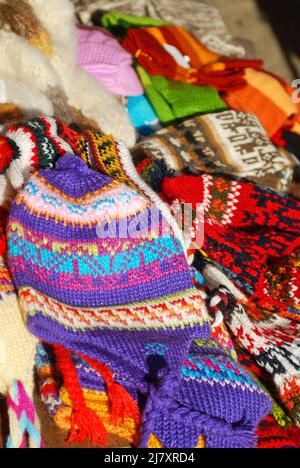 Group of colorful Chilean snow caps for sale at Chiloe market. Stock Photo