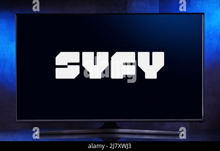 POZNAN, POL - MAR 25, 2022: Flat-screen TV set displaying logo of Syfy, an American basic cable channel owned by the NBCUniversal Television and Strea Stock Photo