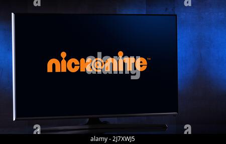 POZNAN, POL - MAR 25, 2022: Flat-screen TV set displaying logo of Nick at Nite, an American nighttime programming block that broadcasts over the chann Stock Photo