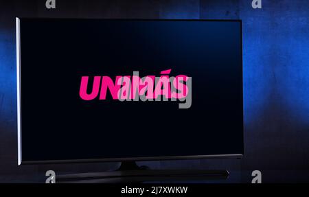 POZNAN, POL - MAR 25, 2022: Flat-screen TV set displaying logo of UniMas, an American Spanish free-to-air television network owned by TelevisaUnivisio Stock Photo