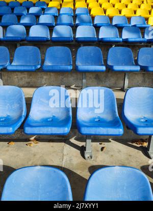 Empty plastic chairs at the stadium. Stock Photo