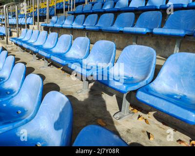Empty plastic chairs at the stadium. Stock Photo