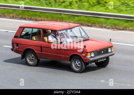 1972 70s seventies red Land Rover 3528cc petrol hard top Range Rover driving on the M6 Motorway, UK Stock Photo