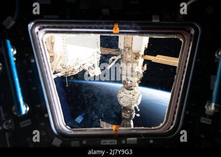 A view looking out from a window on the International Space Station cupola of the Russian components including (from bottom) the Soyuz MS-21 crew ship, the Prichal docking module, and the Nauka multipurpose laboratory module, May 4, 2022 in Earth Orbit. Stock Photo