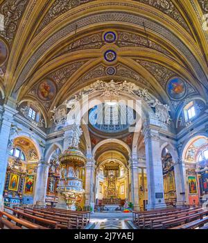 Panoramic view on the interior of Collegiate Church with outstanding colorful decoration, BEllinzona, Switzerland Stock Photo