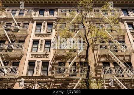 Fire escapes on an occupied multiple dwelling in Greenwich Village in New York on Friday, April 29, 2022. (© Richard B. Levine) Stock Photo