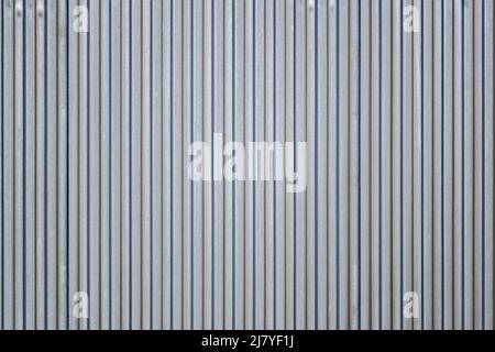 The surface of the corrugated sheet vertically oriented, narrow rows. Texture or background Stock Photo