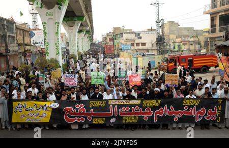 People seen near a rally of leaders and activists of Tehreek-e-Nifaaz Fiqah Jafferia (TNFJ) against the government of Saudi Arabia during a protest on the occasion of Youm-e-Inhedaam-e-Janat-ul-Baqi at muree road in Rawalpindi, Pakistan on May 10, 2022. Destruction of Jannat ul Baqi Day was observed globally against the demolition of holy shrines on the sacred land of Hijaz, a century back, with renewed commitment to end religious extremism and restore the holy shrines of Muslims on the call of Chief of Tehreek e Nifaz e Fiqh e Jafariya Agha Syed Hamid Ali Shah Moosavi. (Photo by Zubair Abbasi Stock Photo