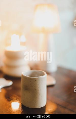 ceramic cup on a cozy warm background indoors.  Stock Photo