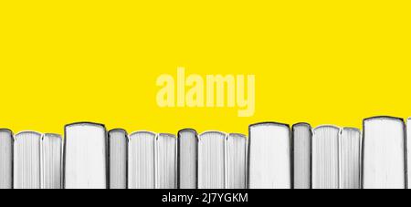 Banner with book border on yellow background, copy space. High quality photo Stock Photo