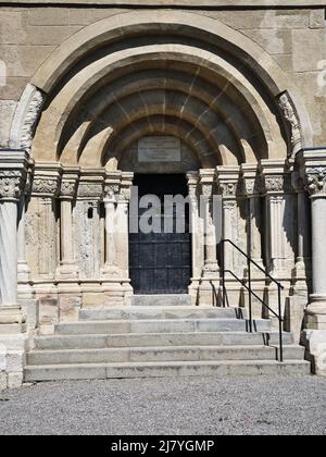 Romanesque entrance portal with stone columns and steps at the Karner chapel in Bad Deutsch-Altenburg, Austria. Stock Photo