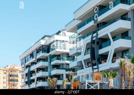 Detail of a new luxury home and residential complex. Part of a modern residential apartment with a flat building exterior. Stock Photo