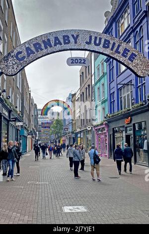 Carnaby Street London England UK with a rainbow for gay pride and a ...