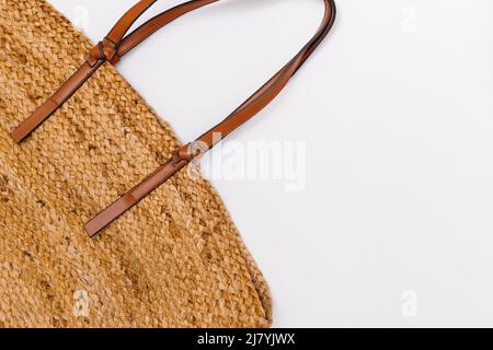 Stylish straw bag on white background, top view. Summer accessories Stock Photo
