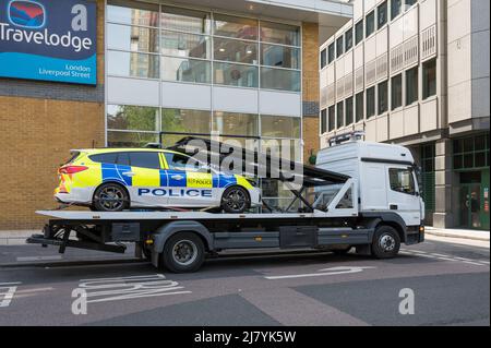 City of London police car on the back of a small transport truck. London, England, UK Stock Photo